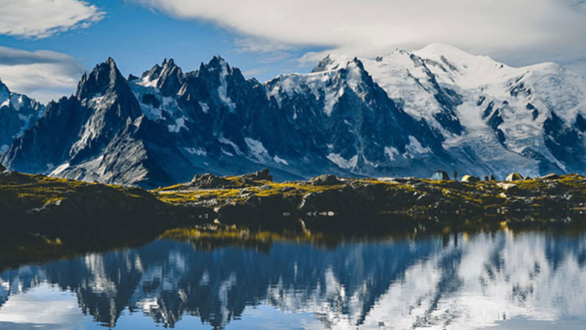 Snowy mountains reflected in a lake
